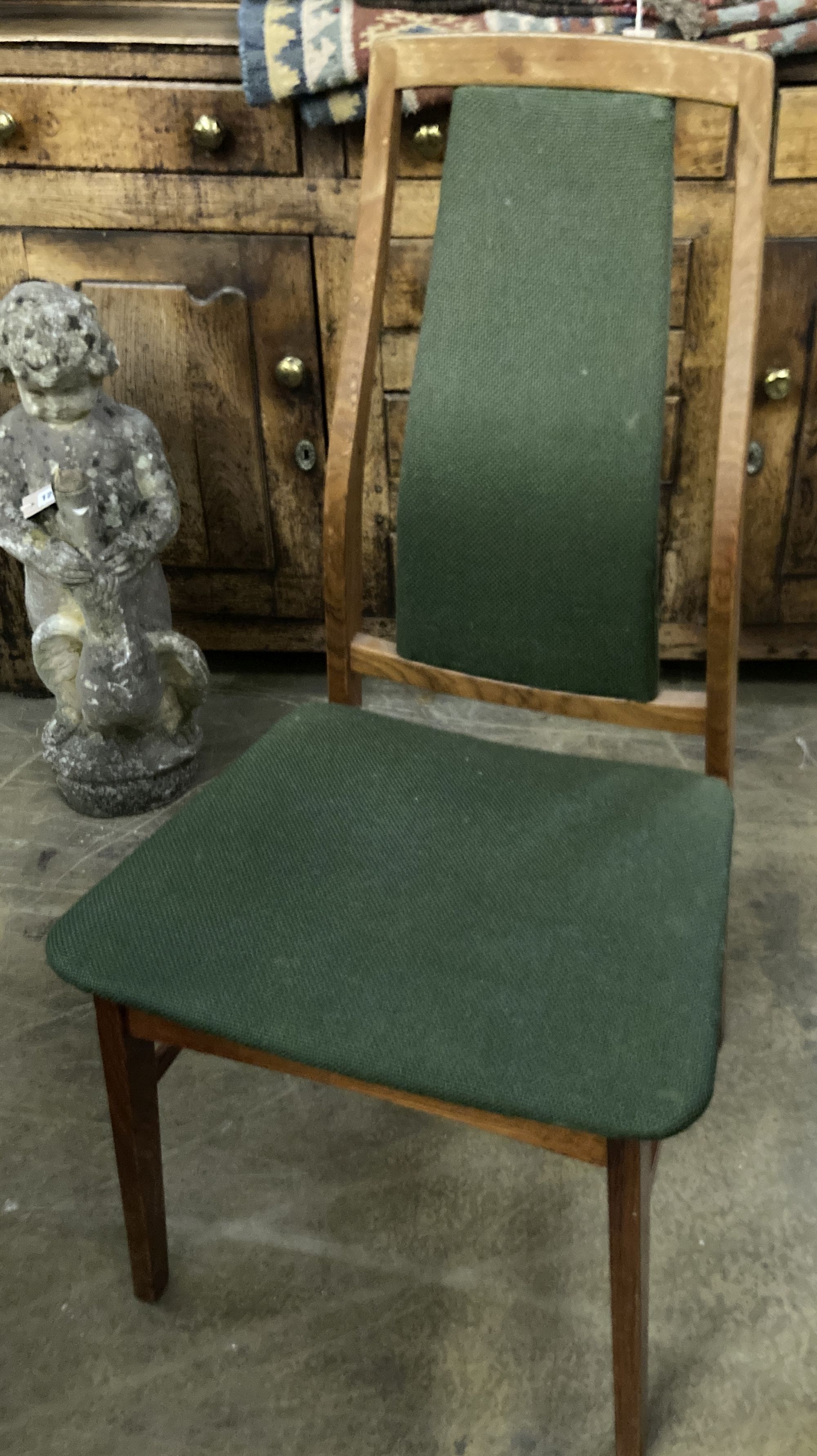 A set of eight mid century design Danish teak high back dining chairs